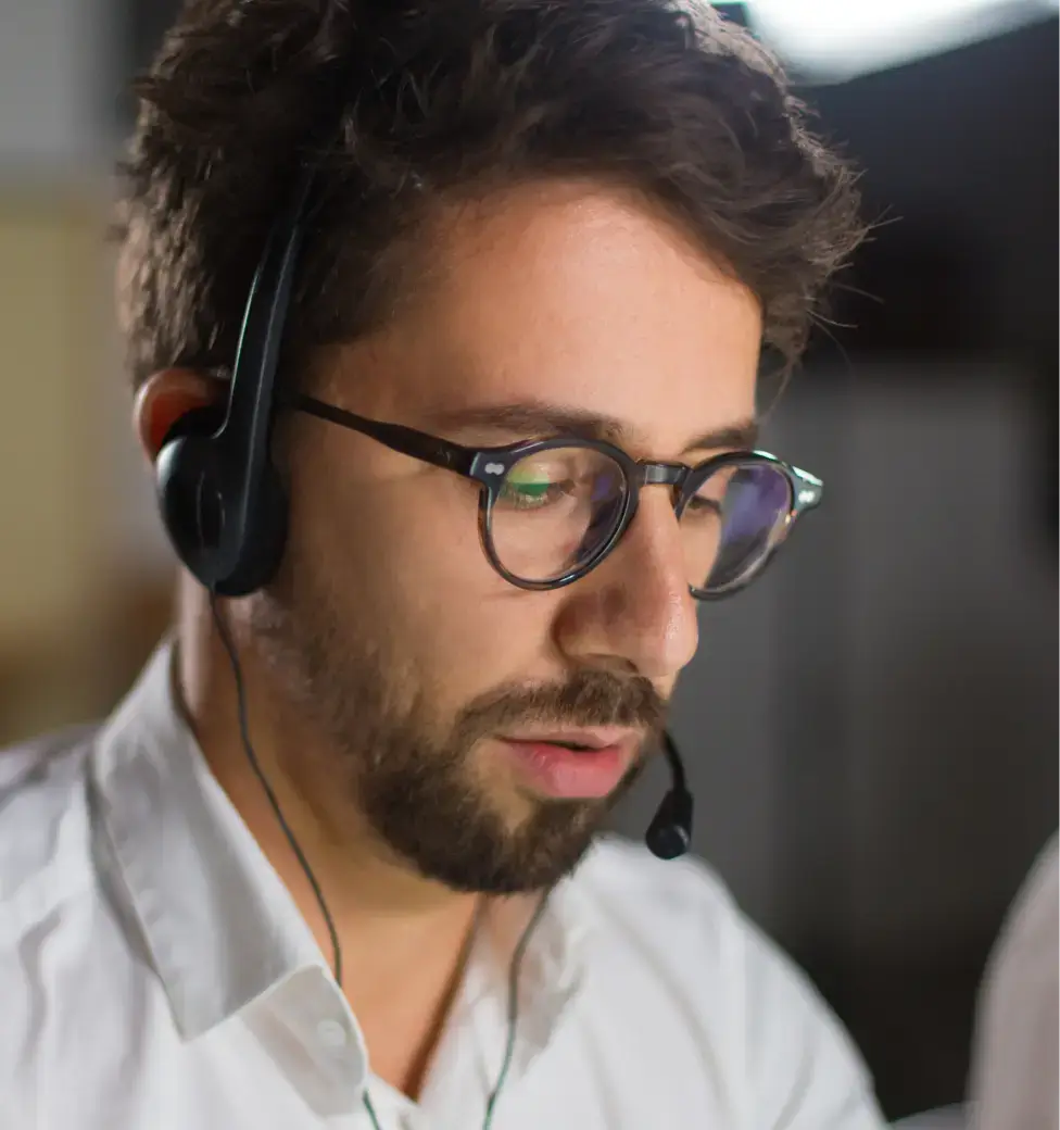 Person wearing headphones, focused expression.