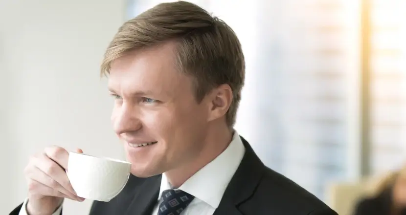 a quiet man drinking his coffee